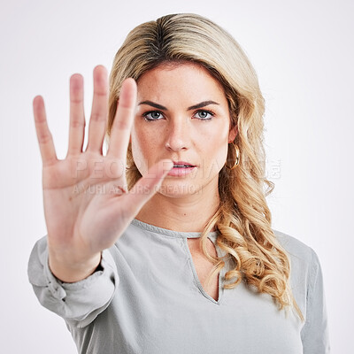 Buy stock photo Stop hand, woman and portrait in a studio with protest, emoji and warning hands gesture. Serious, self defense and female model with reject, refuse and no palm sign isolated with white background