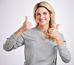 Portrait, thumbs up and motivation with a woman on a gray background in studio to say thank you. Face, hands and welcome with an attractive young female indoor to gesture an emoji of support