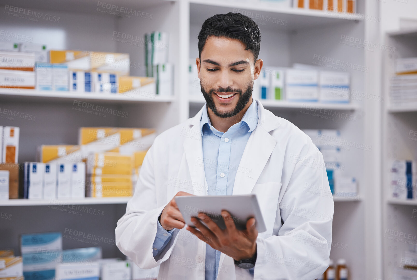 Buy stock photo Pharmacy, happy man or pharmacist reading on tablet for research or checking medical prescription on shelf. Digital or doctor with online checklist on clinic shelves or drugstore inventory storage 