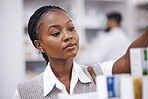Pharmacy stock, black woman and medication check of a customer in a healthcare and wellness store. Medical, inventory and pharmaceutical label information checking of a female person by a shop shelf