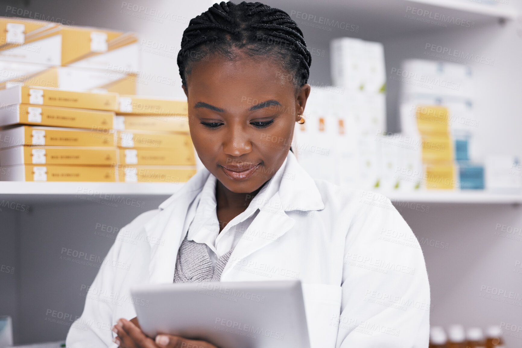 Buy stock photo Black woman in pharmacy with tablet, online inventory list and prescription medicine on shelf. Female pharmacist reading digital checklist, advice and medical professional checking drugs in store.