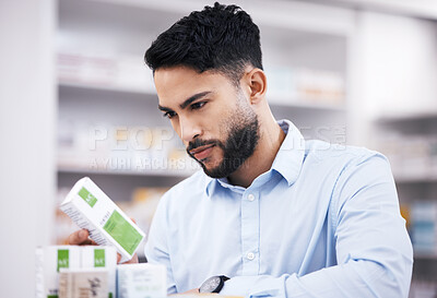 Buy stock photo Pharmacy stock, man and medicine retail check of a customer in a healthcare and wellness store. Medical, inventory and pills label information checking and reading of a male person by a shop shelf
