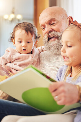 Buy stock photo Grandfather, children and book reading on living room sofa with love, storytelling or learning support. Happy, home or kid with elderly man in house with a story books and youth education on a couch