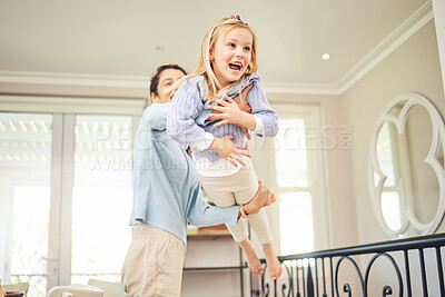 Buy stock photo Laughing, playful and mother with daughter at home for bonding, support and care on the weekend. Relax, airplane and happiness with woman carrying child for happy family, funny and flying games