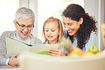 Grandmother, reading and mother and girl with book for bonding, homework and learning at home. Child development, happy family and mom, grandma and kid with educational story, literature and novel