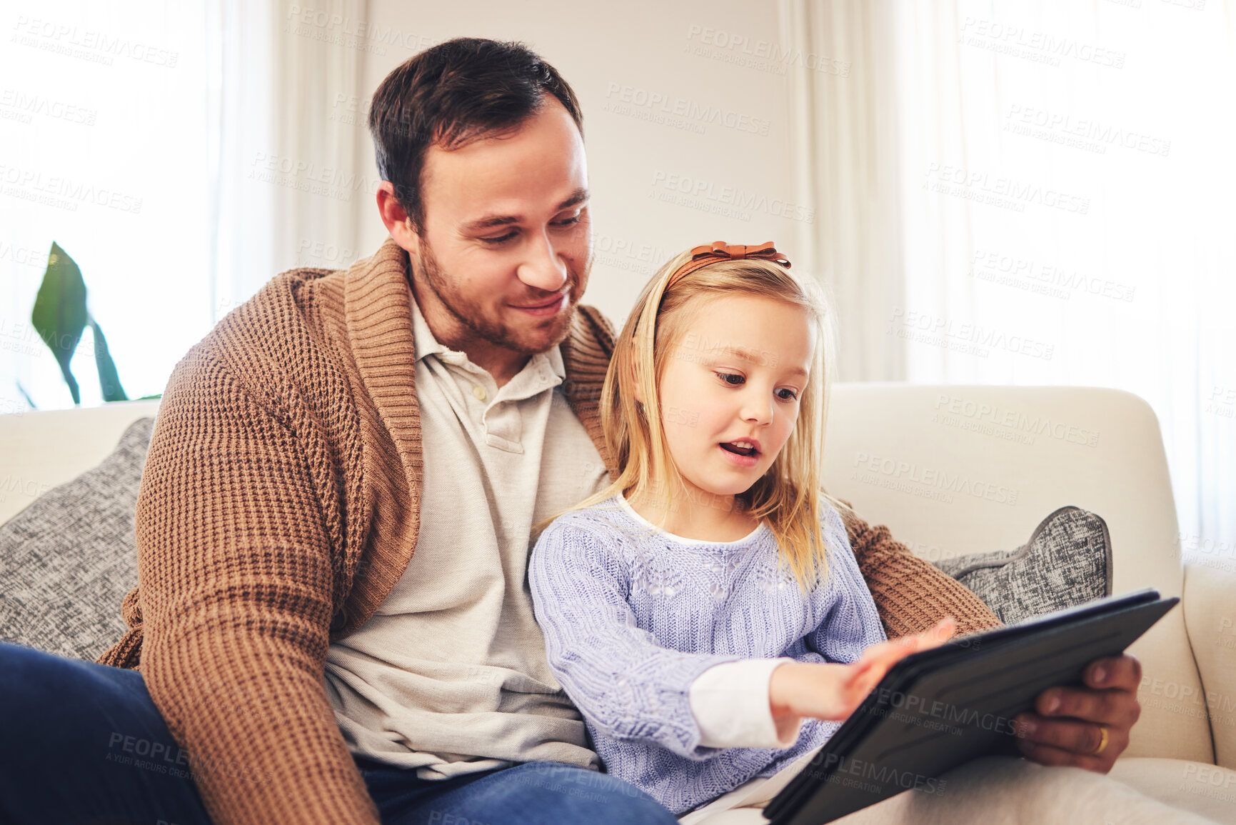Buy stock photo Family, father and a child with a tablet for learning at home while playing a game for education on internet. A man or dad and girl kid on sofa for streaming, mobile app and website for development 
