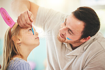 Buy stock photo Easter, fun and father with daughter and face painting for celebration, holiday and bonding. Art, color and party with young girl and man in family home for happiness, vacation or relax 