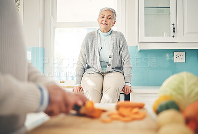 Buy stock photo Cooking, food and a senior couple in the kitchen of their home together during retirement for meal preparation. Health, wellness or nutrition with a mature man and woman making supper in their house