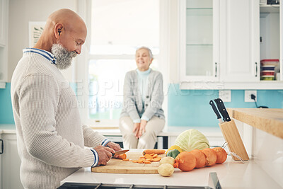 Buy stock photo Cooking, food and a mature couple in the kitchen of their home together during retirement for meal preparation. Health, wellness or nutrition with an old man and woman making supper in their house