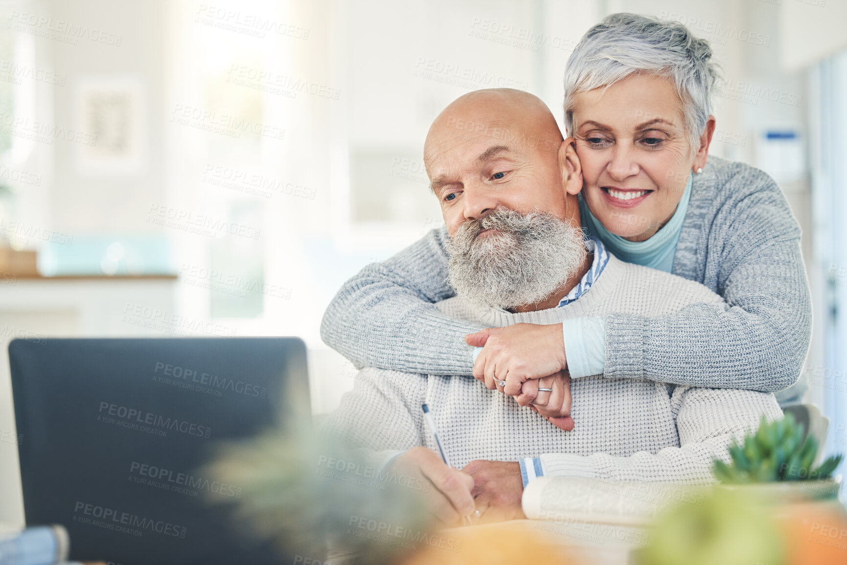 Buy stock photo Laptop, elderly couple and hug in home, internet browsing or social media in house. Computer, retirement and happy man and woman embrace while reading email, news or streaming video together online.