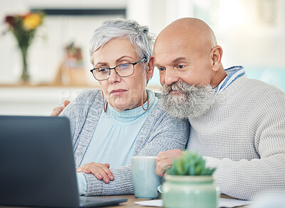Buy stock photo Laptop, senior couple and video call in home, internet browsing or social network in house. Computer, retirement and serious man and woman in virtual conference, online chat or communication together
