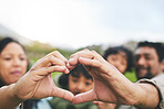Family, heart and hands outdoor in nature for quality time, love and care outdoor. Man, woman and kids with emoji, icon or sign at a park on vacation, holiday or travel trip for bonding and support
