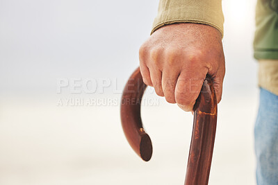 Buy stock photo Hand, senior man with disability and cane or walking stick for support. Injury or osteoarthritis, physical therapy or rehabilitation and elderly patient holding a wooden walk aid in closeup on mockup