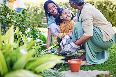 Buy stock photo A woman, mother and daughter gardening together outdoor for growth or sustainability during spring. Plants, children and earth day with a family bonding in the garden for eco friendly landscaping