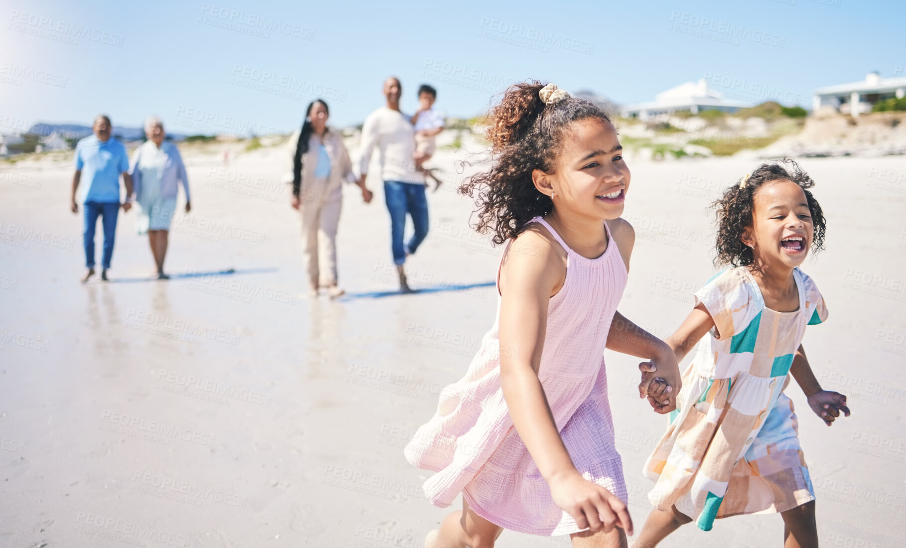 Buy stock photo Children running, family vacation and happy at the beach for travel, morning walking and bonding. Happy, summer and girl siblings holding hands on a walk at the ocean with parents and grandparents