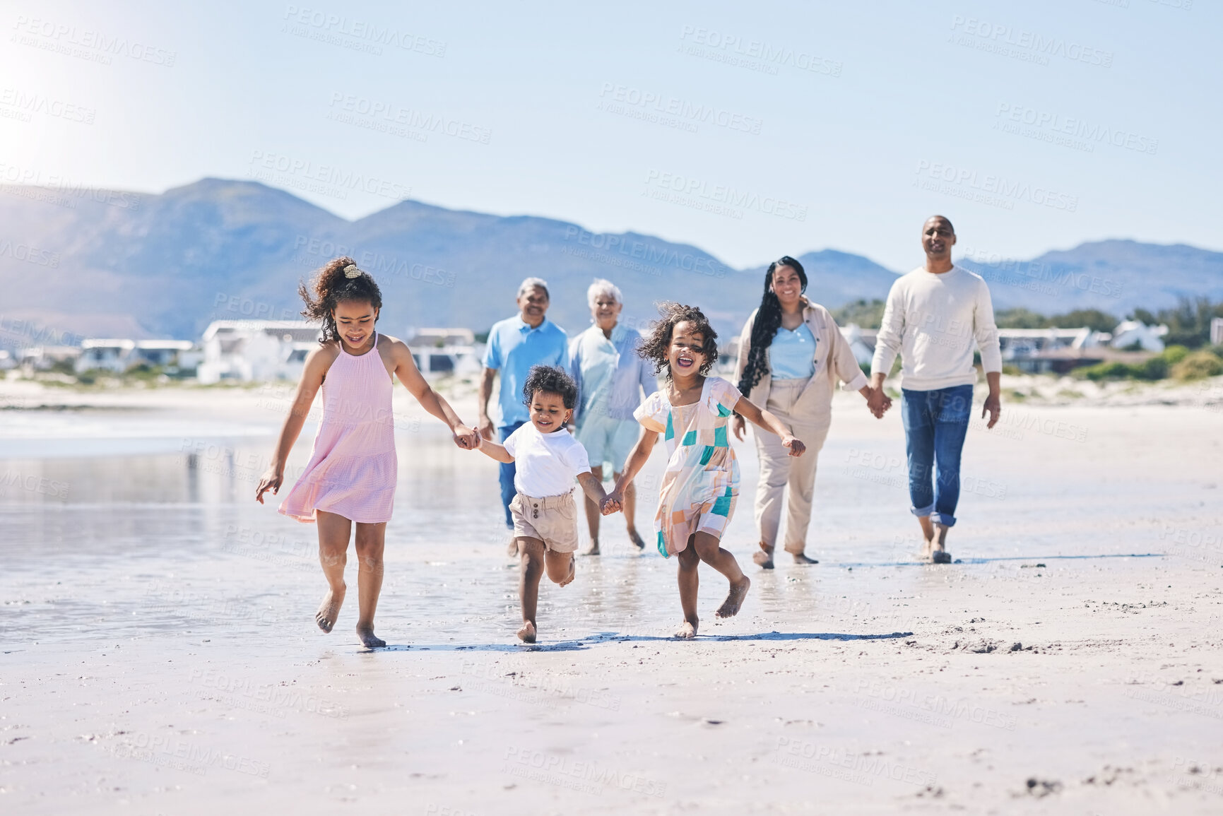 Buy stock photo Beach, big family and children holding hands, running and happiness on summer vacation together in Mexico. Sunshine, fun and bonding, men, women and kids on holiday walk on happy morning with energy.