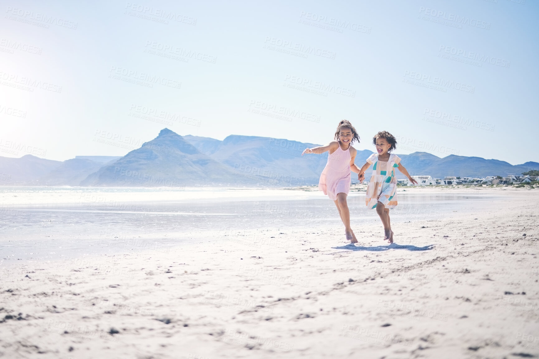 Buy stock photo Girl kids, holding hands and run at beach with space for mockup by water, together and bond with love in summer. Female children, play game or race for siblings, family and ocean mock up in sunshine