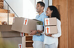 Excited, homeowners and couple with boxes, moving in and happiness with excitement. Love, man and woman with a smile, partnership and relationship with real estate, mortgage and cheerful together