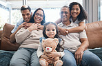 Happy family in portrait with men, women and child with teddy bear on sofa, new home, happiness and quality time. Parents, grandparents and kid on couch to celebrate property investment with smile.