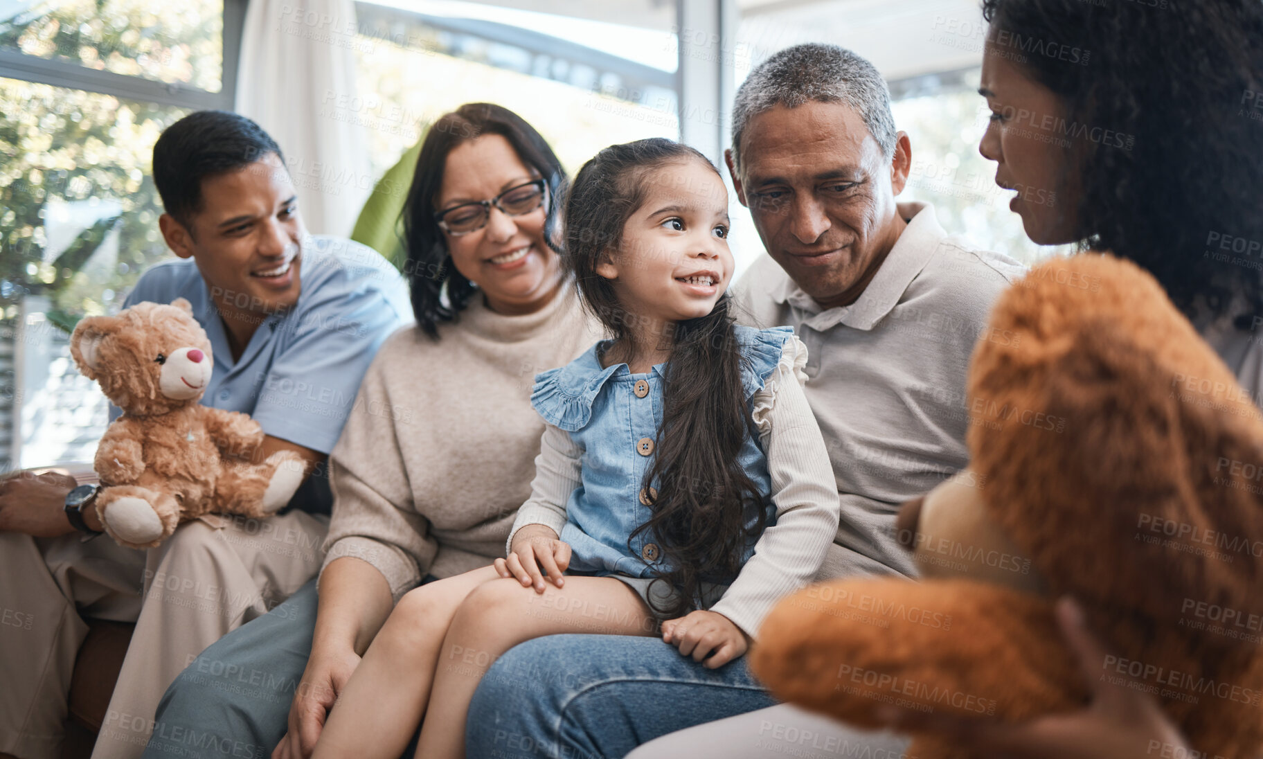 Buy stock photo Parents, grandparents and girl with teddy bear on sofa, bonding and smile for family in home living room. Men, women and female child with toys, love and happiness on lounge couch in house on holiday