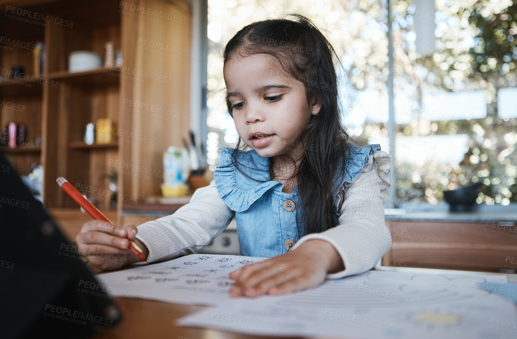 Buy stock photo Learning, education and girl writing in at a kitchen table for homework, drawing and home school activity. Education, student and kid with paper for sketch, art and lesson for child development