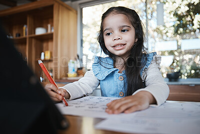 Buy stock photo E learning, education and girl writing at a kitchen table for homework, drawing and home school activity. Online, happy student and kid with paper for sketch, art and lesson for child development