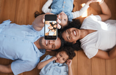 Buy stock photo Smile, happy family on floor and selfie from above with love, bonding and quality time together. Mom, dad and kids taking picture for social media, happiness and fun, parents with children in home.