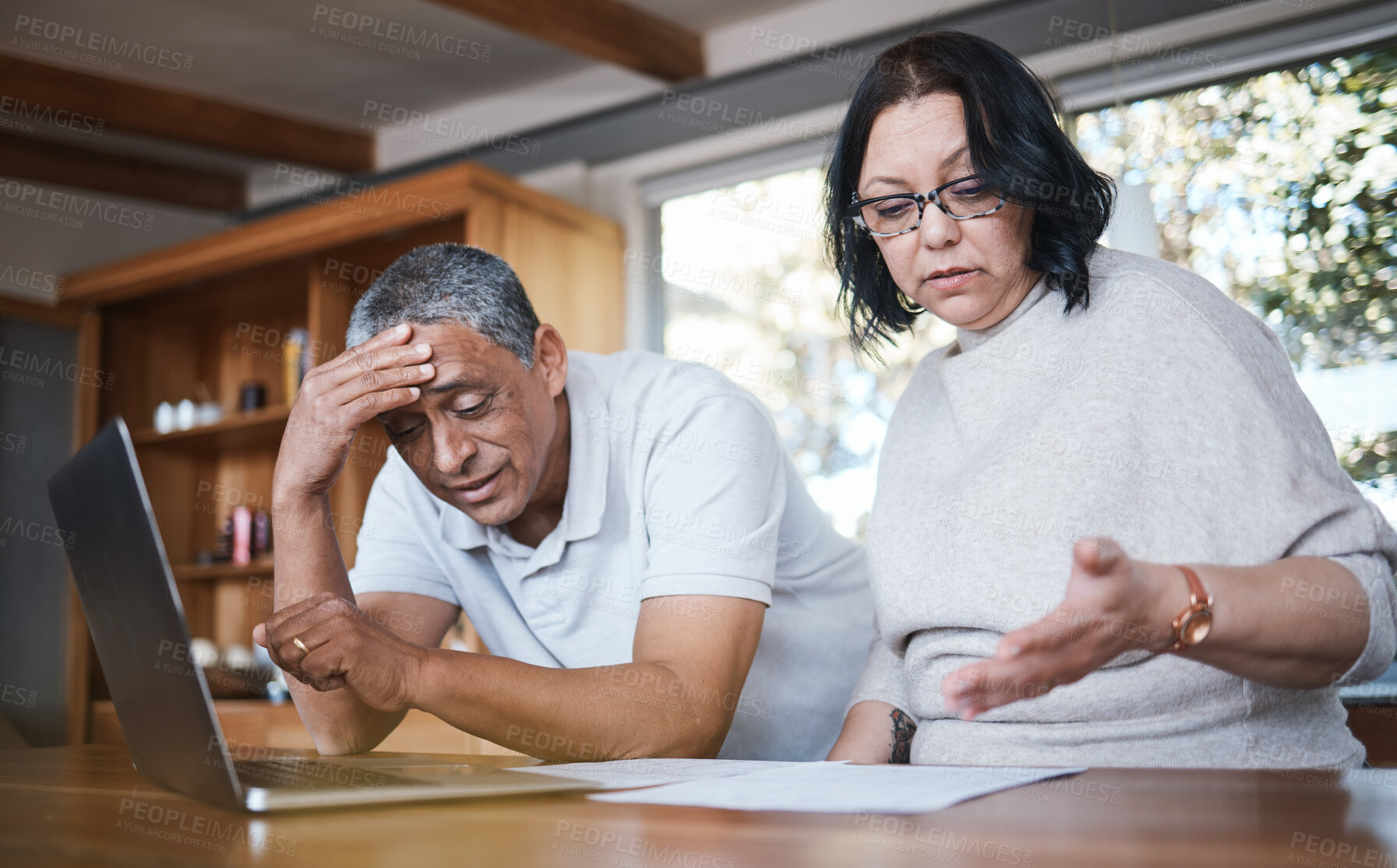 Buy stock photo Mature couple, debt and stress of budget in home with anxiety, planning money and mortgage bills. Frustrated man, woman and overwhelmed with documents, taxes and financial crisis of inflation problem