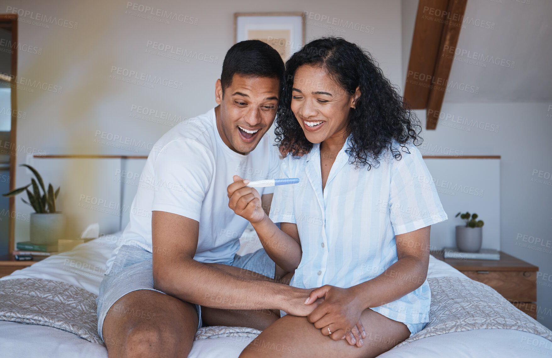 Buy stock photo Pregnant, test and excited couple on bed with positive results, good news and celebration at home. Pregnancy, maternity and happy man and woman in bedroom for fertility, future family and surprise