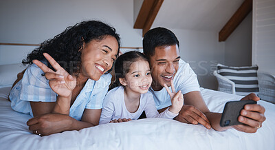 Buy stock photo Family, smile and peace sign selfie in bedroom, bonding or having fun together on bed. Hand gesture, happiness or kid, mother and father taking photo for social media, happy memory or profile picture