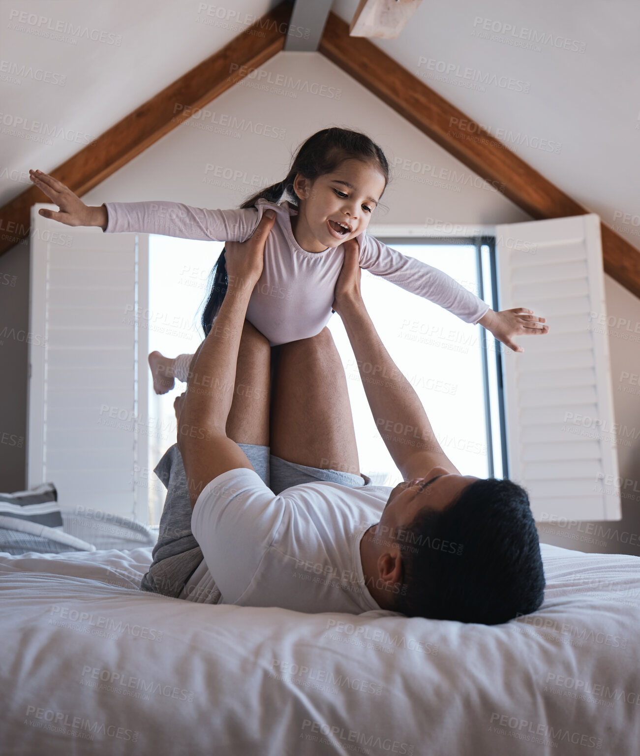 Buy stock photo Airplane, game and child with father on a bed happy, playing and bonding in the morning together. Flying, fun and excited girl with parent in a bedroom for creative, fantasy and childhood happiness 