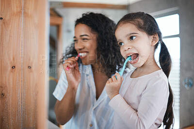 Buy stock photo Brushing teeth, child and mom with dental cleaning and learning in a bathroom. Mother, kid and smile of wellbeing and wellness with happiness of health care and toothbrush in the morning at home