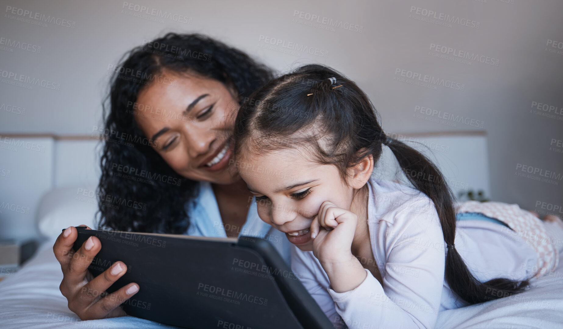 Buy stock photo Mother, tablet and kid relax on bed in home bedroom, social media or online browsing. Technology, happiness and mom and girl with touchscreen for learning, streaming film or video together in house