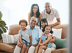 Portrait, love and big family on a couch, smile and bonding with happiness, cheerful or joy at home. Face, grandparents or mother with father, siblings or children on a sofa, chilling or quality time