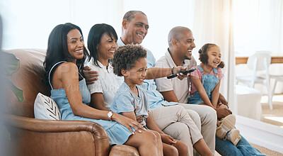 Buy stock photo Happy, big family and watching tv on the sofa together, enjoying a film or comedy show at home. Smile, living room and parents, grandparents and children laughing at the television for happiness