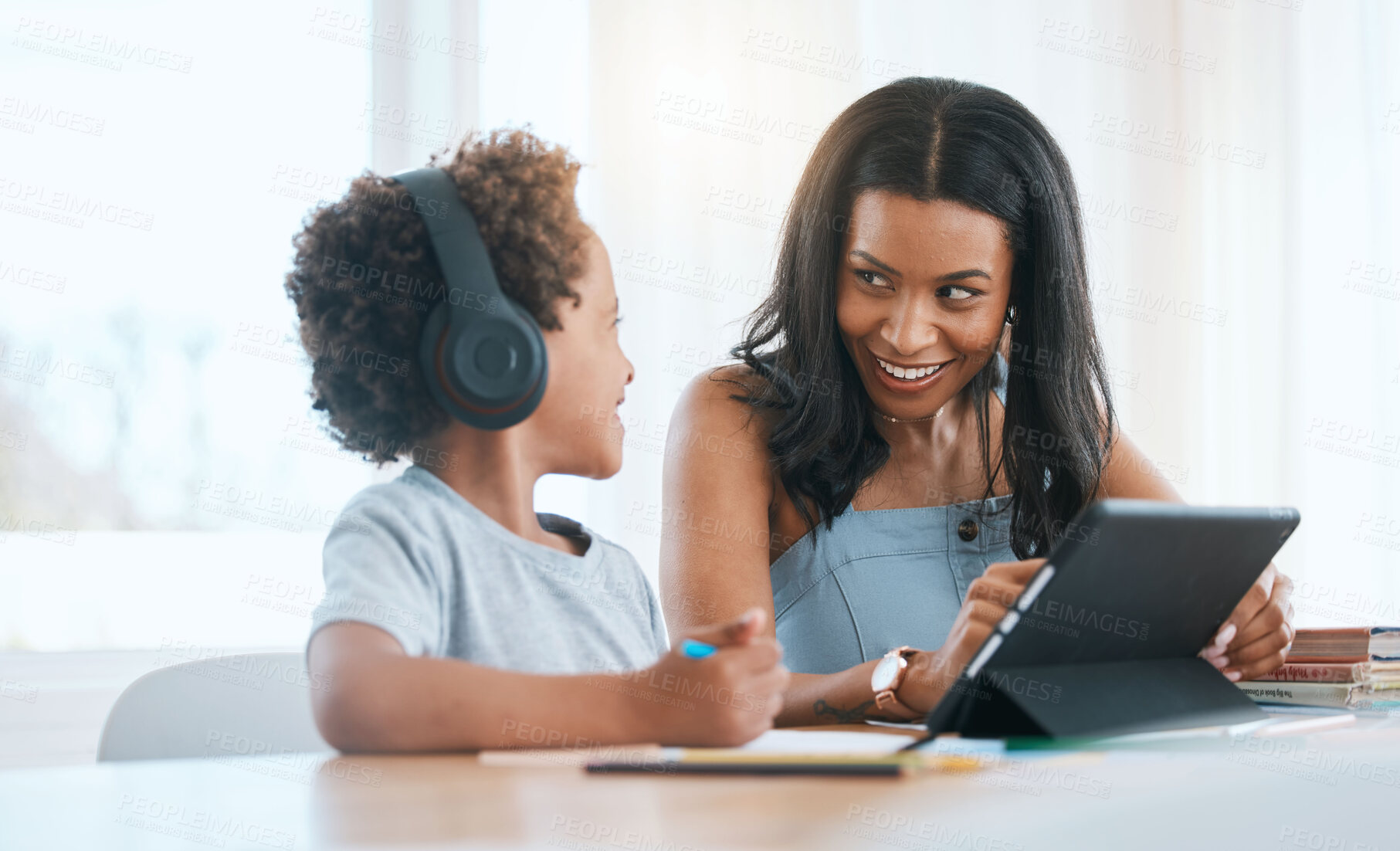 Buy stock photo Elearning, happy and a mother and child with a tablet for education, studying and online class. Smile, teaching and a mom helping a boy kid with homework with technology during homeschooling