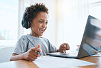 Learning, laptop and headphones of child for online education, language translation and writing in virtual class. Happy african kid on audio tech, computer and web, streaming and development at home