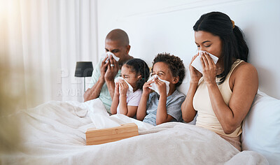 Buy stock photo Sick, flu and family on a bed, tissue and blowing nose with illness, disease and cold at home. Parents, mother and father with siblings, children and kids in a bedroom, allergy and health issue