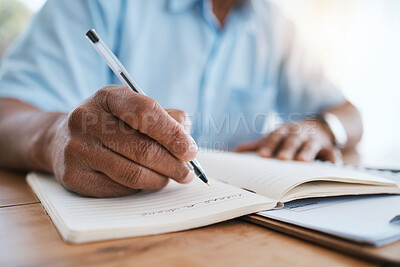 Buy stock photo Man, hands and writing in book for finance, budget or schedule planning in remote work at home. Closeup hand of male freelancer taking notes in diary for financial record, expenses or tasks on desk