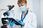 Scientist, tablet and woman with mask in research for cure, results or data at the laboratory. Female medical or science professional working on technology in forensics for scientific search in a lab