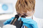 Woman, scientist and microscope in forensics for discovery, breakthrough or scientific research in lab. Female medical professional or expert in healthcare or science examination or experiment