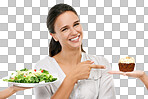 Salad, cake and woman with unhealthy decision in studio for food, sugar and diet marketing. Chocolate cupcake, green vegetable and model happy decision or hand sign isolated on png background and mockup