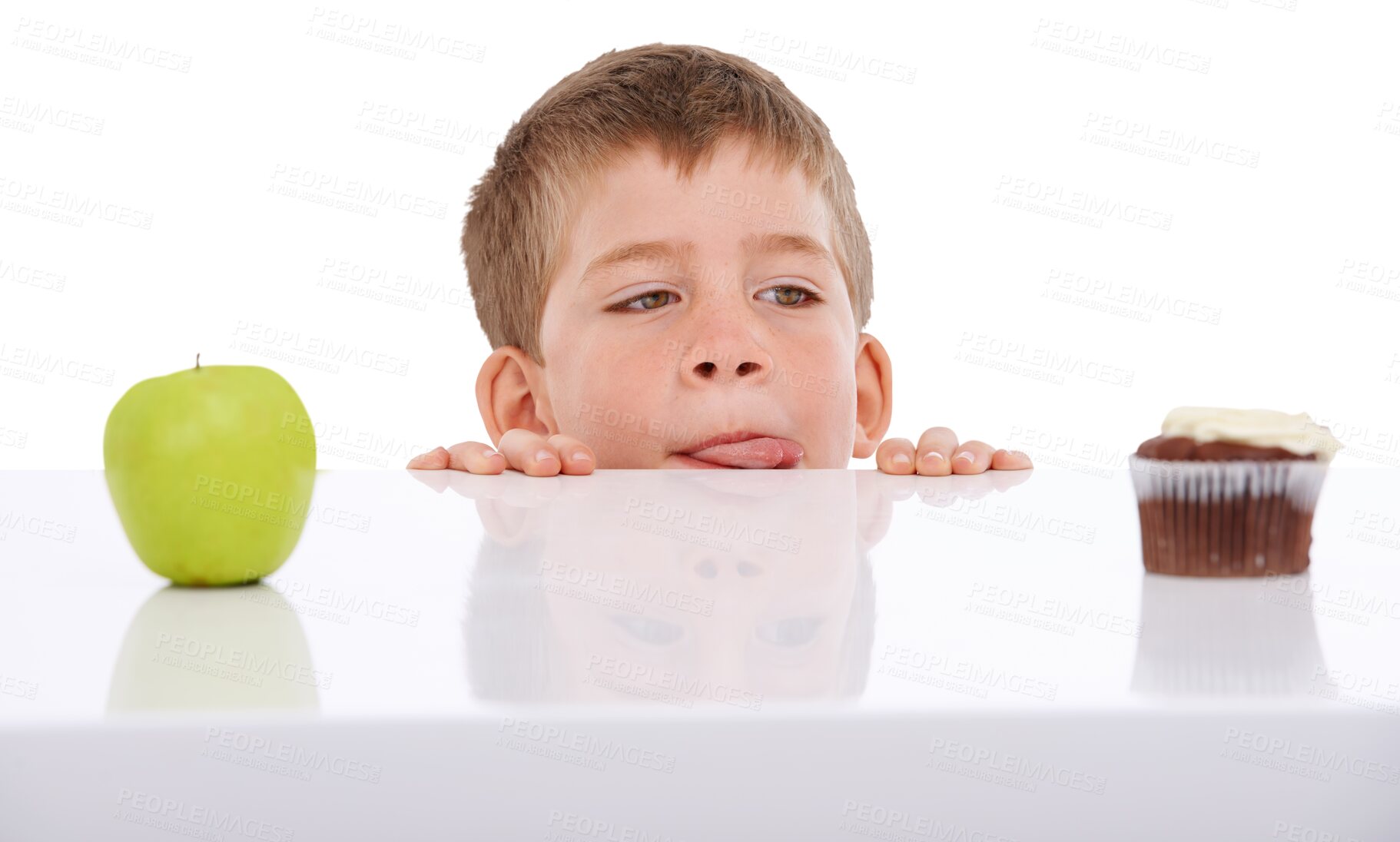 Buy stock photo Face, choice and kid with apple and cupcake on isolated, png and transparent background. Childhood, unhealthy eating and young boy with food, cake and decision for dessert, fruit and luxury treats