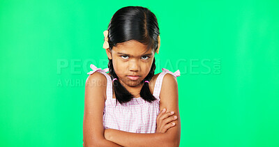 Angry, crossed arms and face of child on green screen with upset, disappointed and anger expression. Emoji, mockup studio and portrait of isolated young girl mad, unhappy and shake head for problem