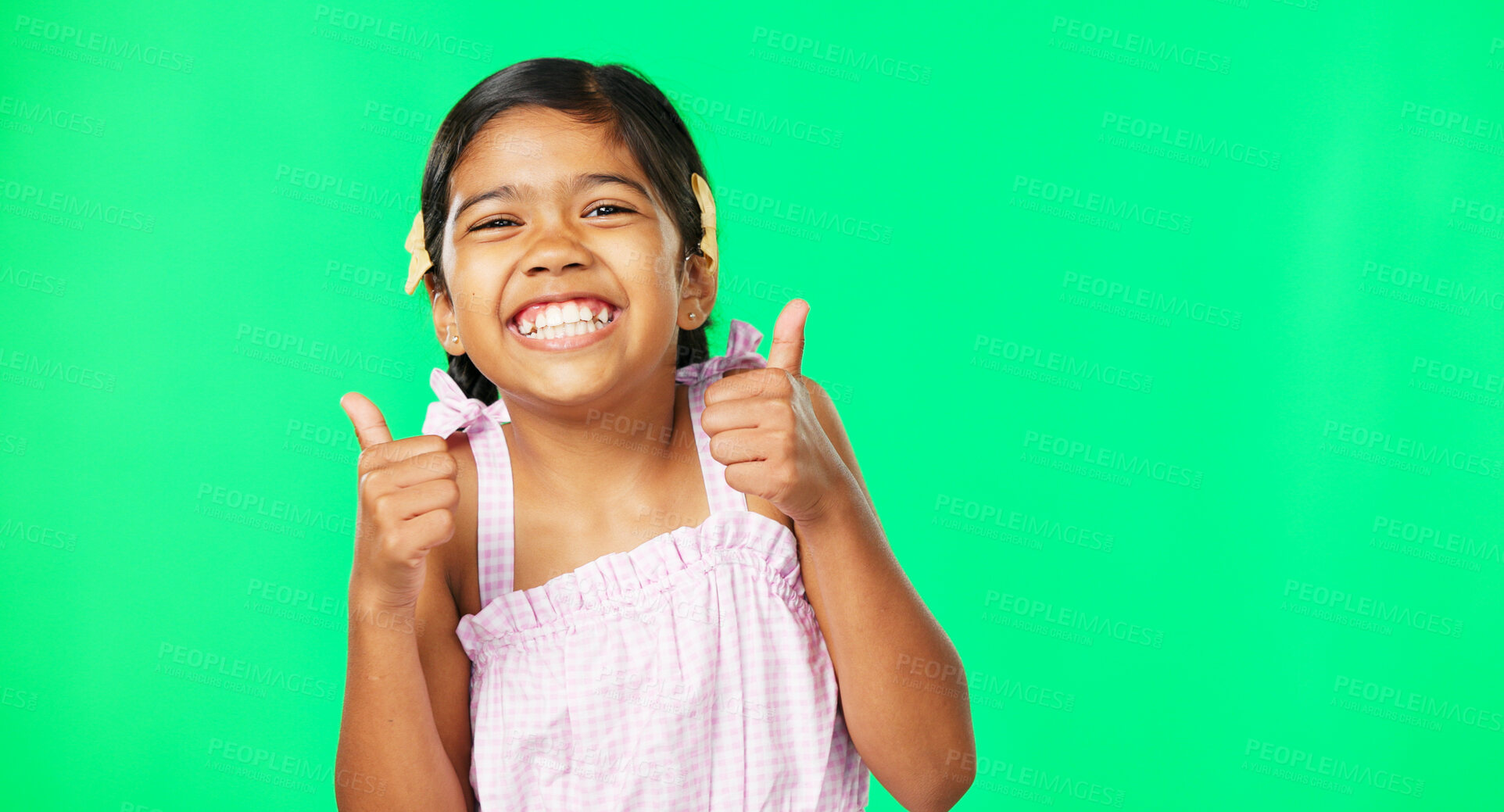 Buy stock photo Girl kid, green screen and thumbs up with agreement and vote, support and happy with feedback or review. Thank you, winner and smile for success with yes or like emoji isolated on studio background