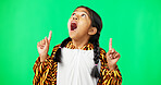 Shock, green screen and face of a child pointing isolated on a studio background. Wow, looking and portrait of a girl gesturing with hands on a mockup space backdrop for announcement or presentation