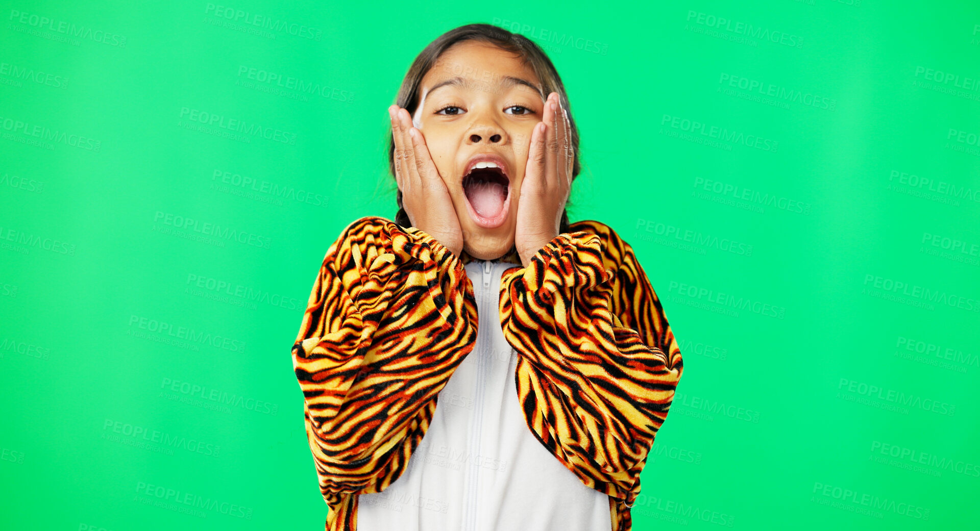 Buy stock photo Girl child, surprise and green screen portrait with tiger costume and hands on face with copy space. Female kid, news announcement and facial gesture with happy with studio, advertising and comedy