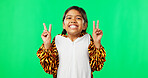 Happy, dance and peace sign with girl in studio for kindness, positive and pride. Happiness, support and gesture with young child isolated on green background for cheerful, carefree and confidence