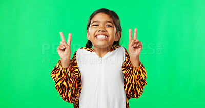 Buy stock photo Girl child, peace sign and green screen with smile, tiger suit pyjamas and happy by studio background. Kid, mock up and animal clothes with v icon, emoji and happy with symbol, portrait and winning