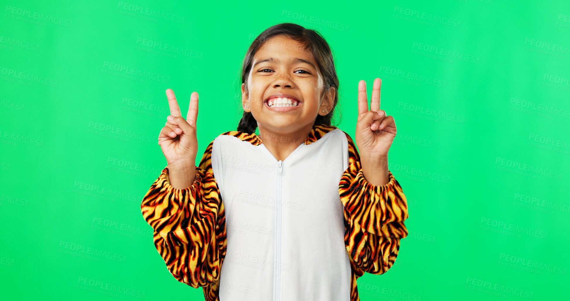 Buy stock photo Girl child, peace sign and green screen with smile, tiger suit pyjamas and happy by studio background. Kid, mock up and animal clothes with v icon, emoji and happy with symbol, portrait and winning